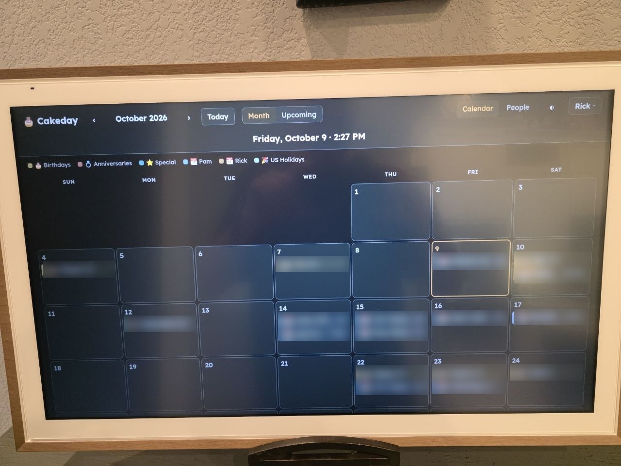 Cakeday’s month view on the entryway display, entries blurred